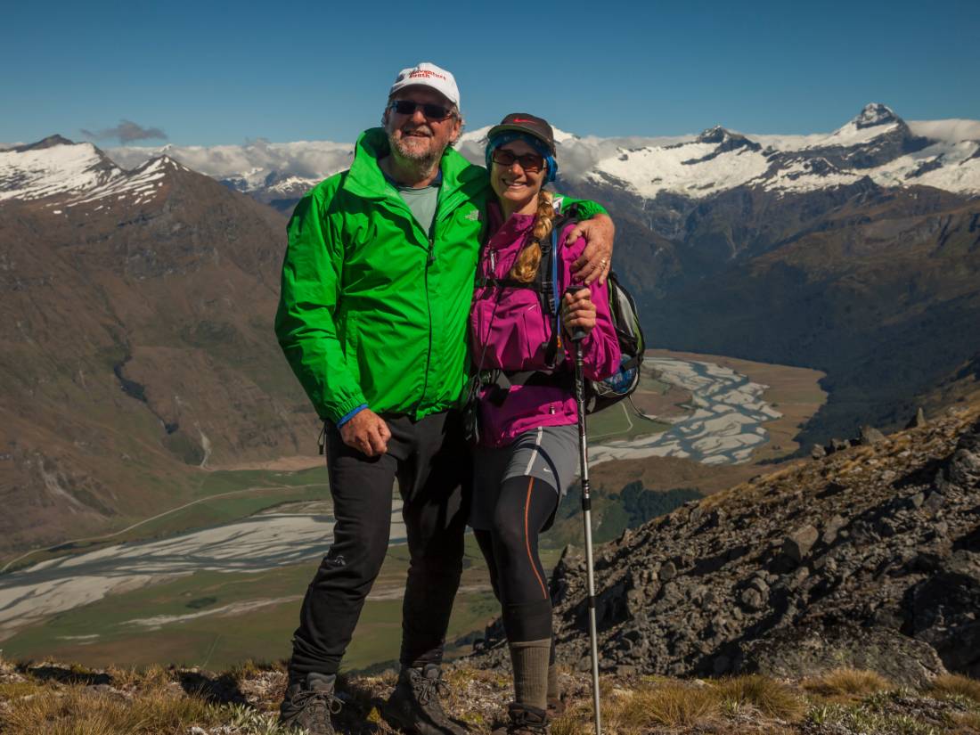 Trekkers on Buchanan peak with Mount Aspiring behind, walking above Matukituki valley, near Lake Wanaka |  Colin Monteath