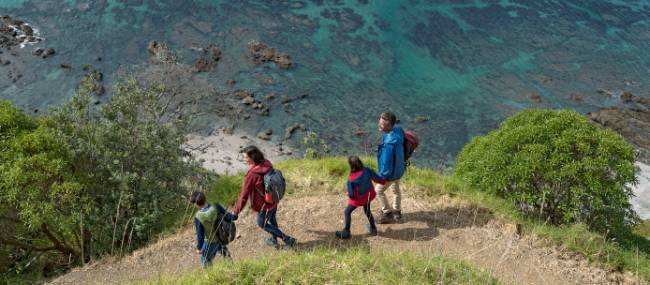 A family out enjoying one of New Zealand's fabulous coastal walks | Fraser Clements